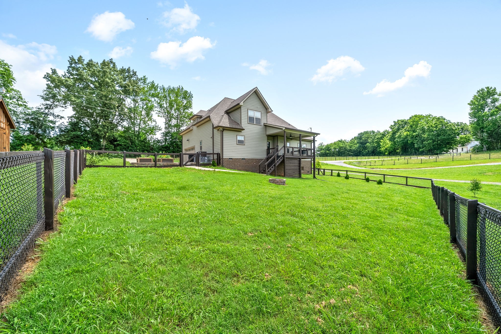 1452 Hickory Point Road Clarksville, TN 37043 - Photo 37 of 38 a view of a house with a big yard and potted plants