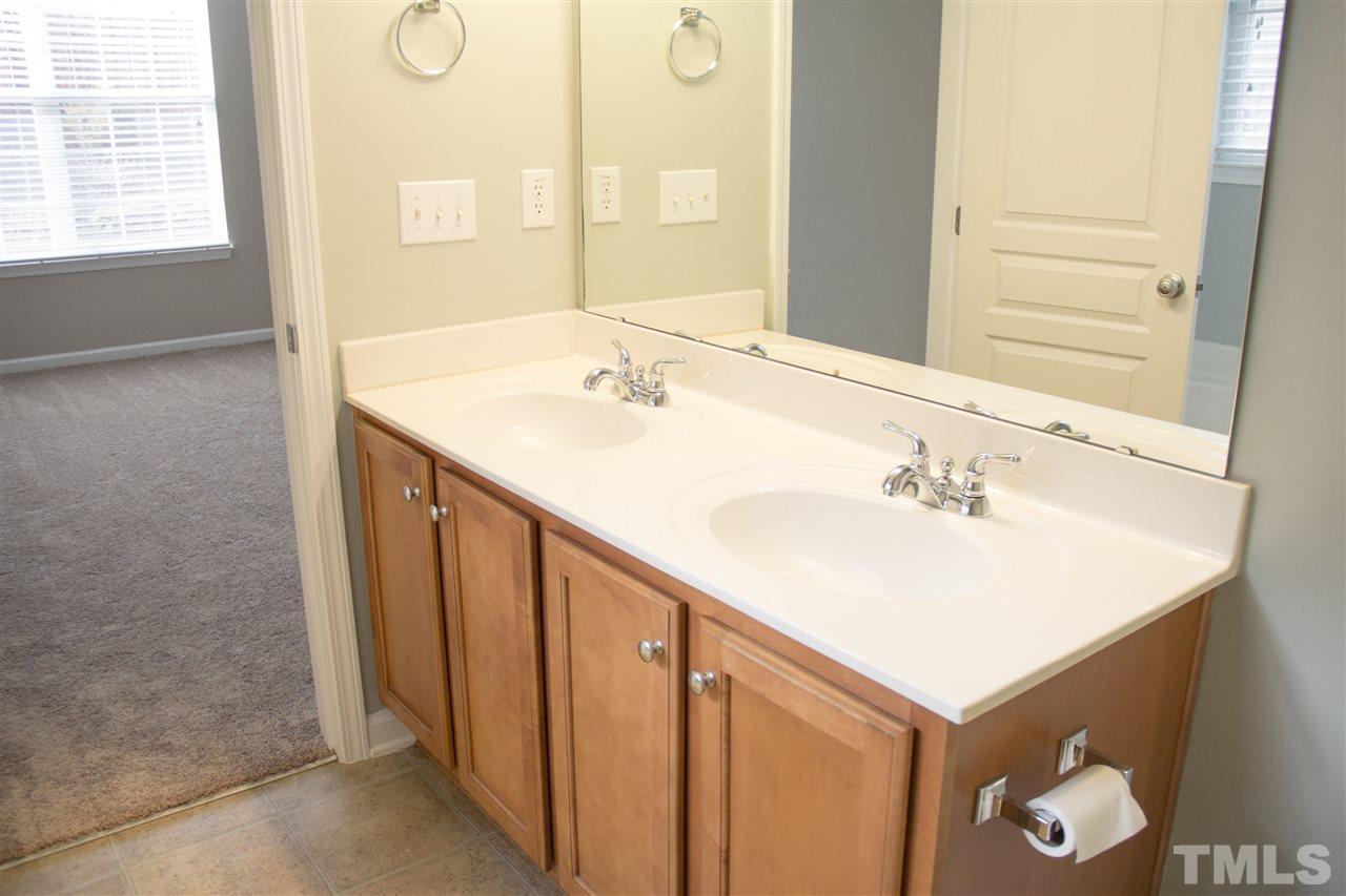 203 Hope Valley Road Knightdale, NC 27545 - Photo 13 of 25 a bathroom with a sink and a mirror