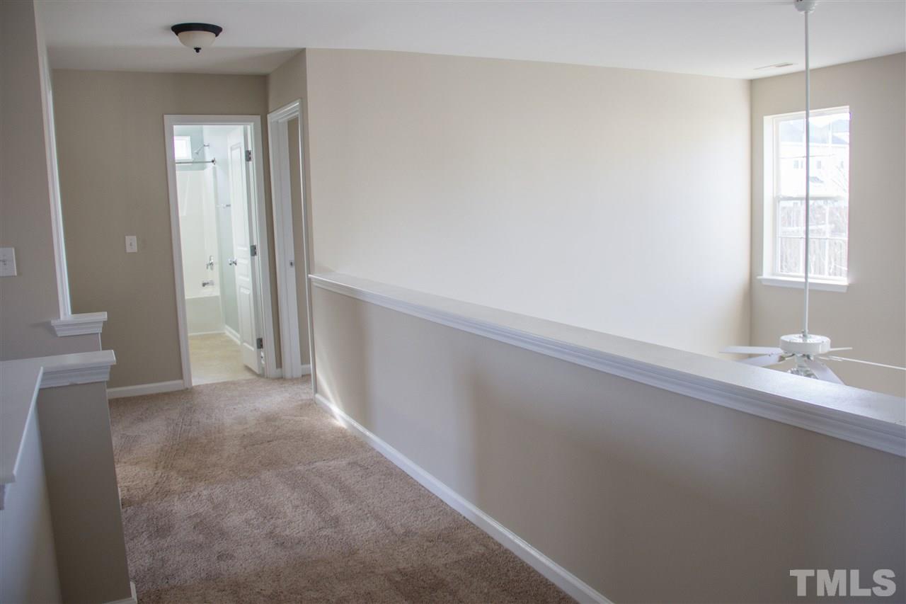 203 Hope Valley Road Knightdale, NC 27545 - Photo 17 of 25 a view of hallway with window and cabinet