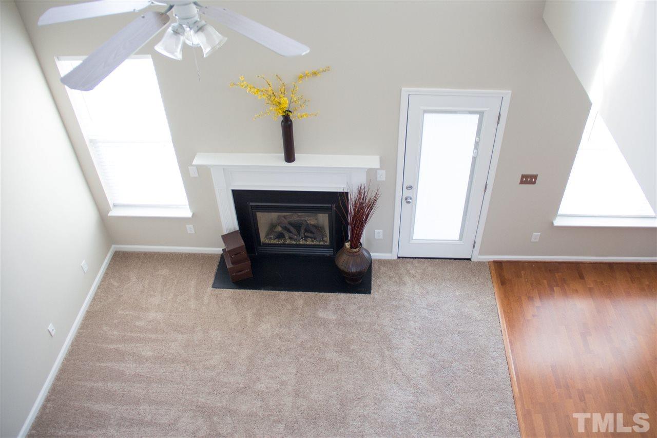 203 Hope Valley Road Knightdale, NC 27545 - Photo 18 of 25 a living room with furniture and a fireplace