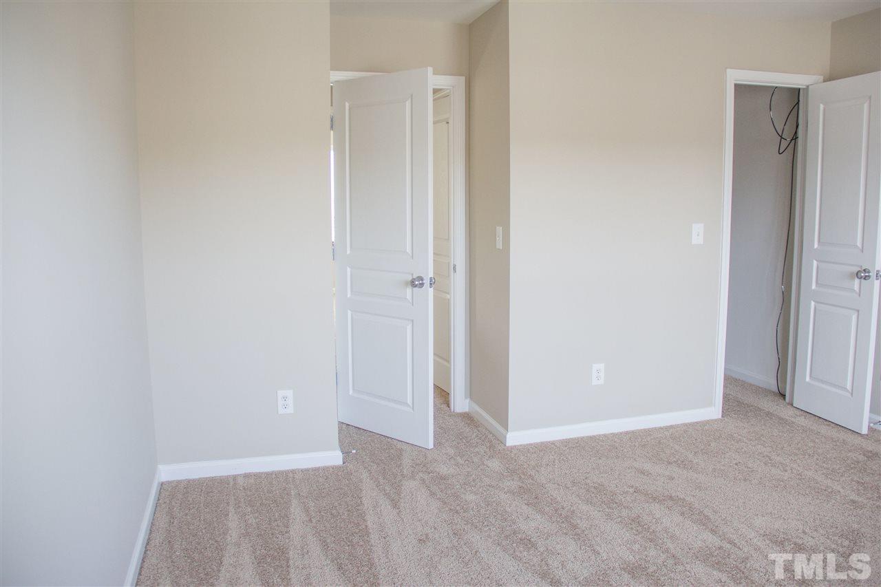203 Hope Valley Road Knightdale, NC 27545 - Photo 20 of 25 a view of an empty room with closet and a window