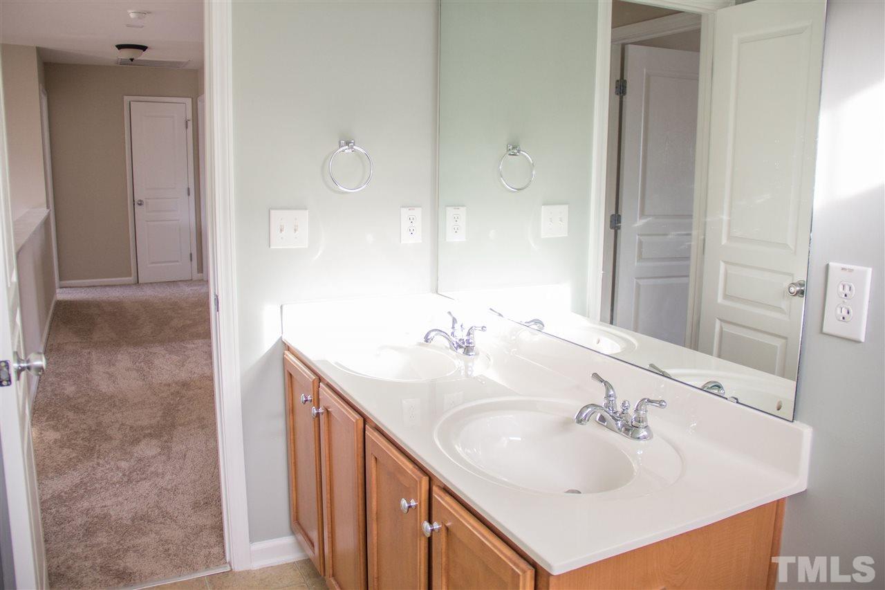 203 Hope Valley Road Knightdale, NC 27545 - Photo 23 of 25 a bathroom with a sink and a mirror