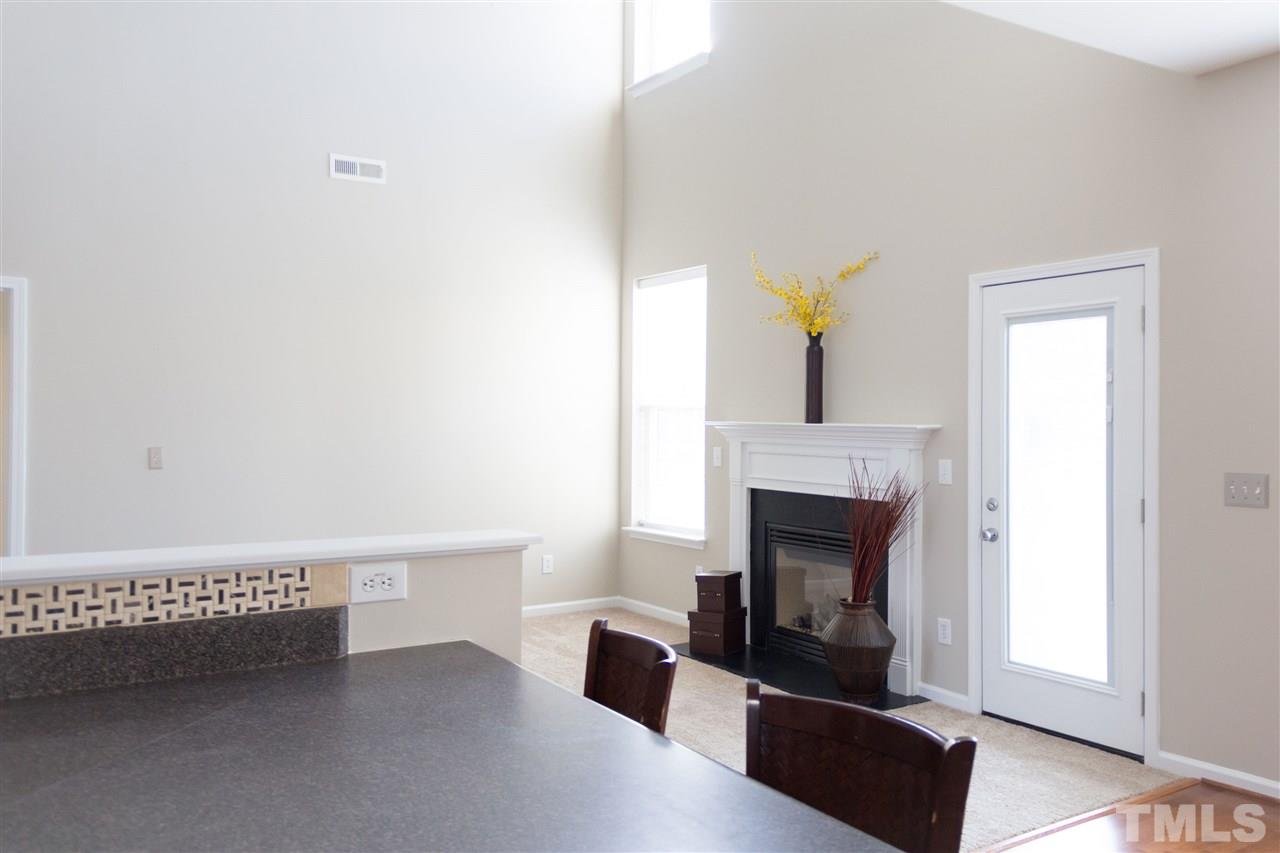 203 Hope Valley Road Knightdale, NC 27545 - Photo 5 of 25 a living room with furniture and a fireplace