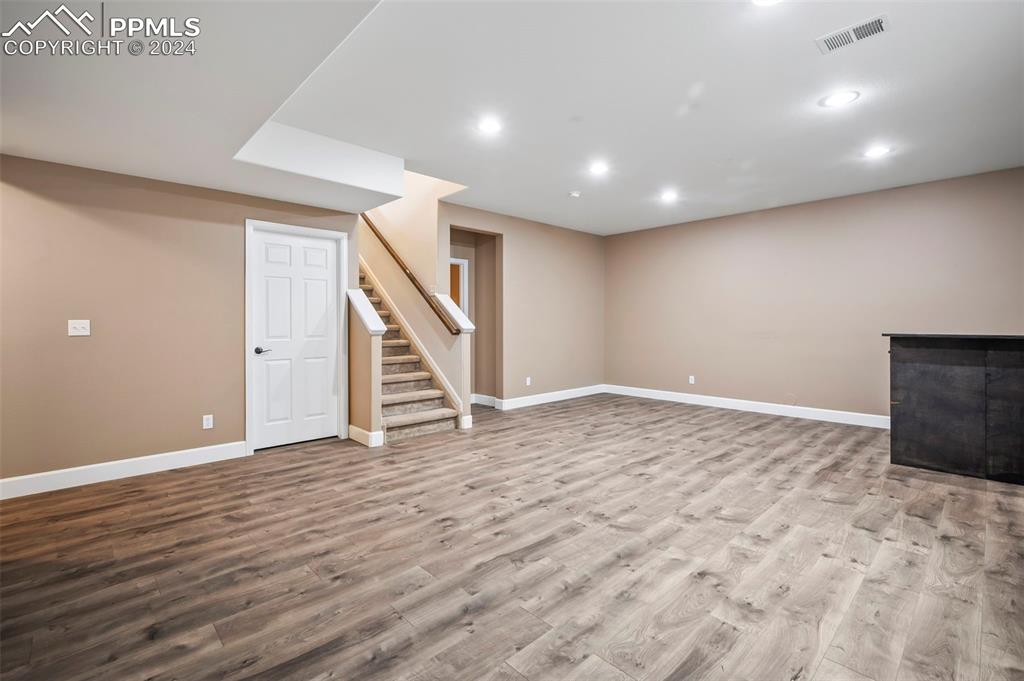 8238 Hollygrape Lane Colorado Springs, CO 80927 - Photo 19 of 35 a view of an empty room with stairs and stairs