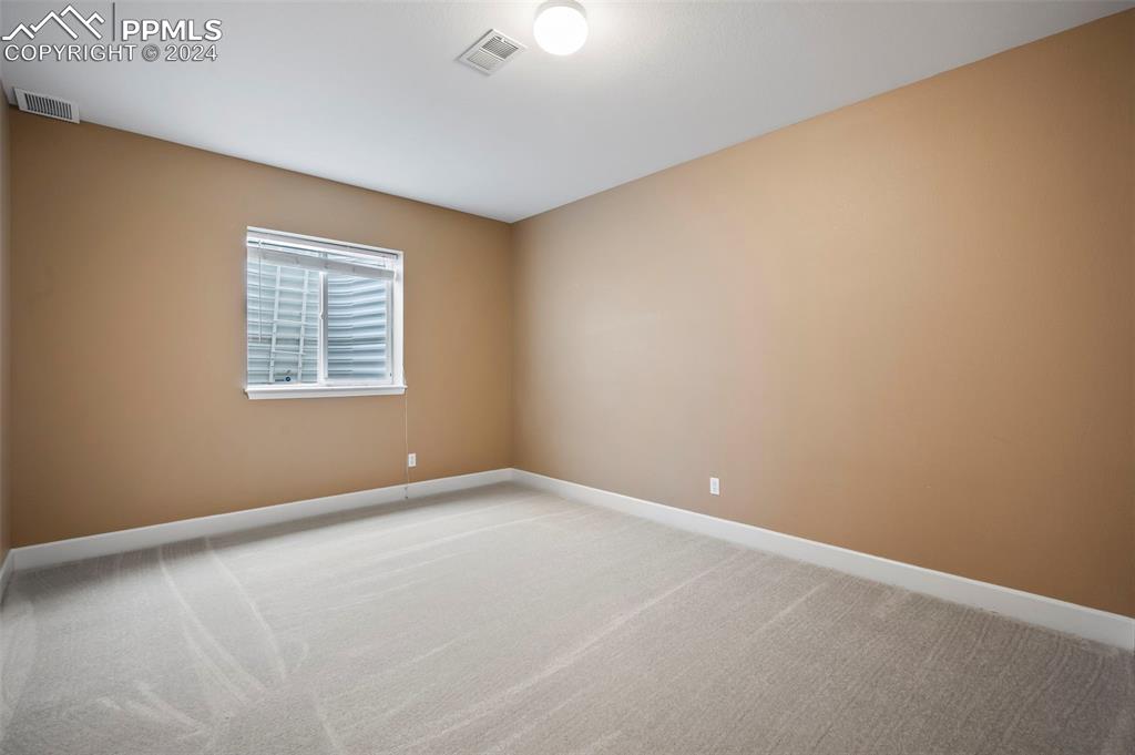8238 Hollygrape Lane Colorado Springs, CO 80927 - Photo 24 of 35 an empty room with a window
