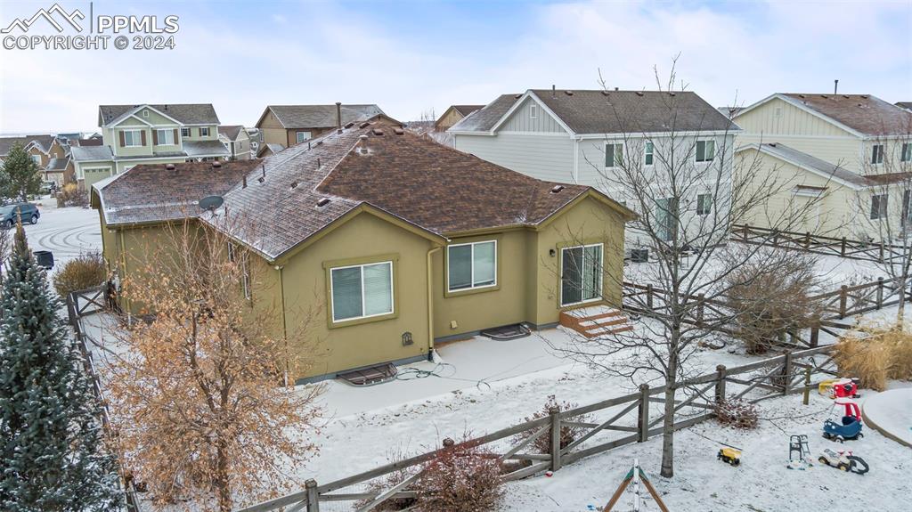 8238 Hollygrape Lane Colorado Springs, CO 80927 - Photo 28 of 35 a view of a house with a bed and chair