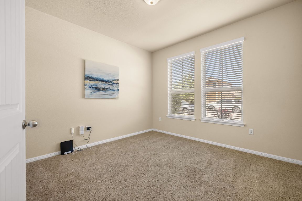 1432 Blake Street Leander, TX 78641 - Photo 13 of 26 an empty room with windows