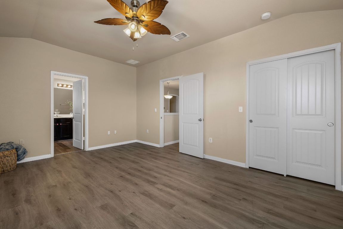 1432 Blake Street Leander, TX 78641 - Photo 15 of 26 wooden floor in an empty room with a window