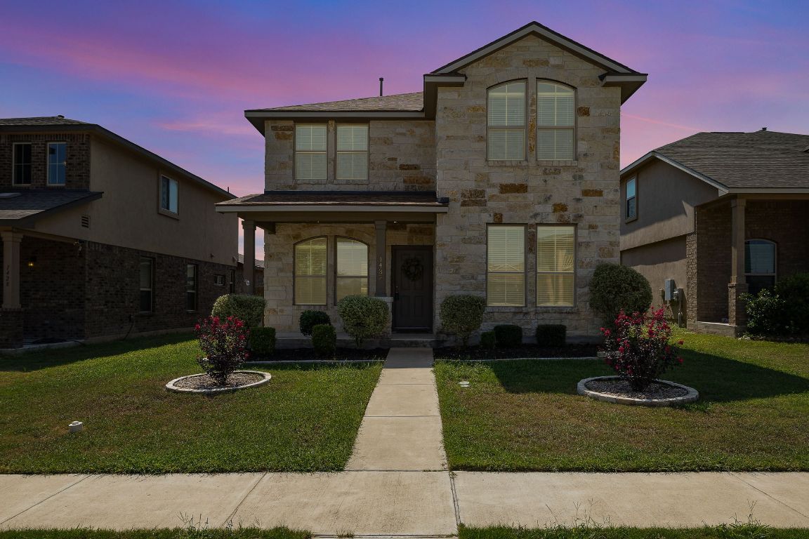 1432 Blake Street Leander, TX 78641 - Photo 2 of 26 a front view of a house with a yard
