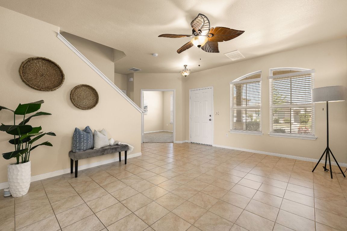 1432 Blake Street Leander, TX 78641 - Photo 3 of 26 a view of entryway with livingroom and chandelier