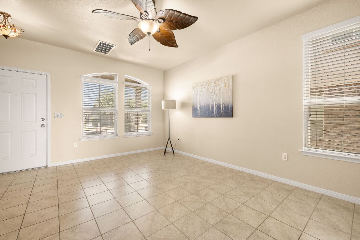 1432 Blake Street Leander, TX 78641 - Photo 4 of 26 a view of an empty room with a window