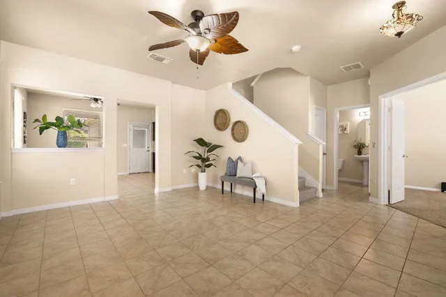 a view of living room with furniture and a chandelier