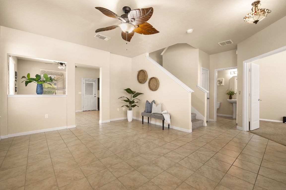 1432 Blake Street Leander, TX 78641 - Photo 5 of 26 a view of living room with furniture and a chandelier