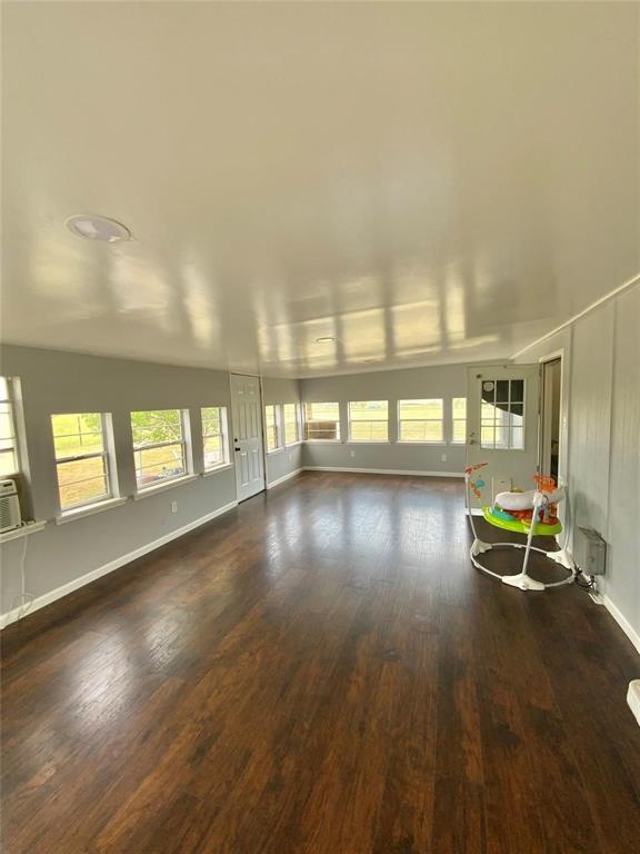 11255 Sam Reynolds Road Justin, TX 76247 - Photo 15 of 19 a view of a room with wooden floor