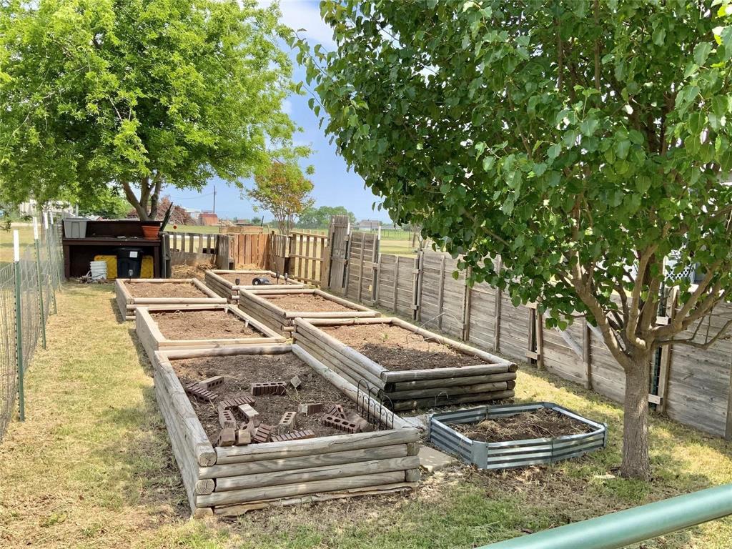 11255 Sam Reynolds Road Justin, TX 76247 - Photo 16 of 19 a view of a swimming pool with a patio