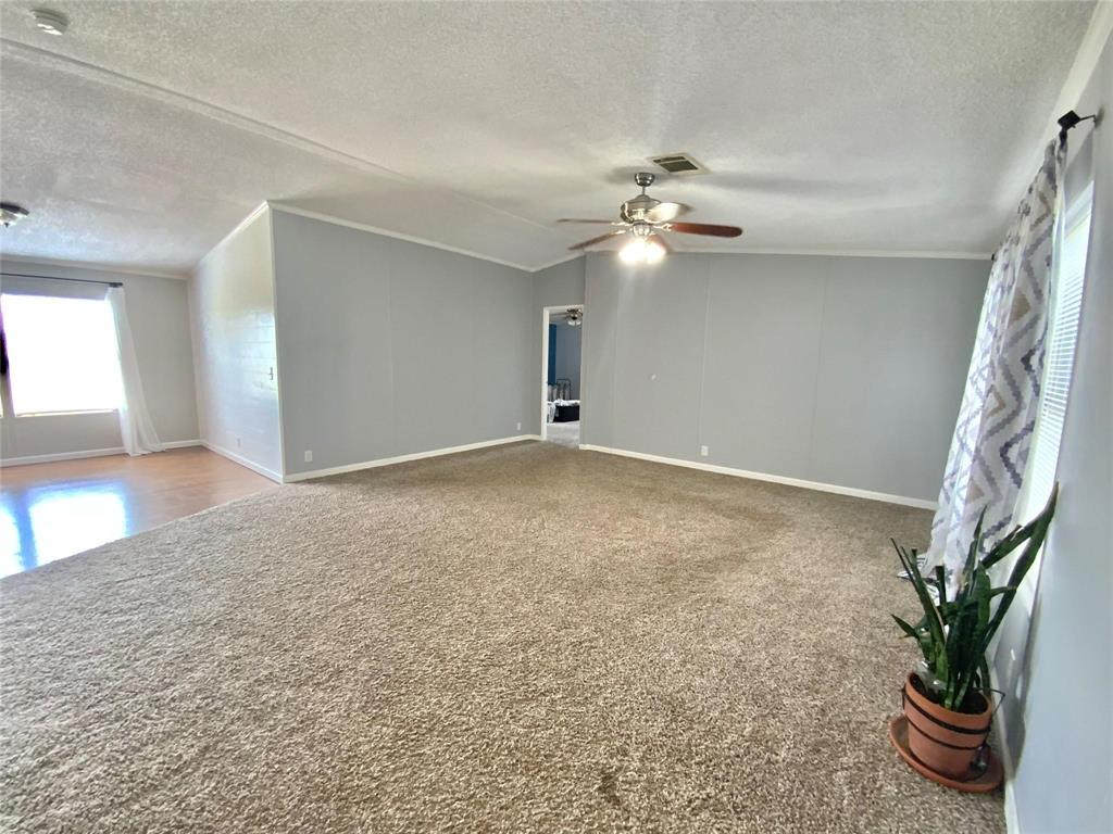 11255 Sam Reynolds Road Justin, TX 76247 - Photo 2 of 19 wooden floor in an empty room with a window