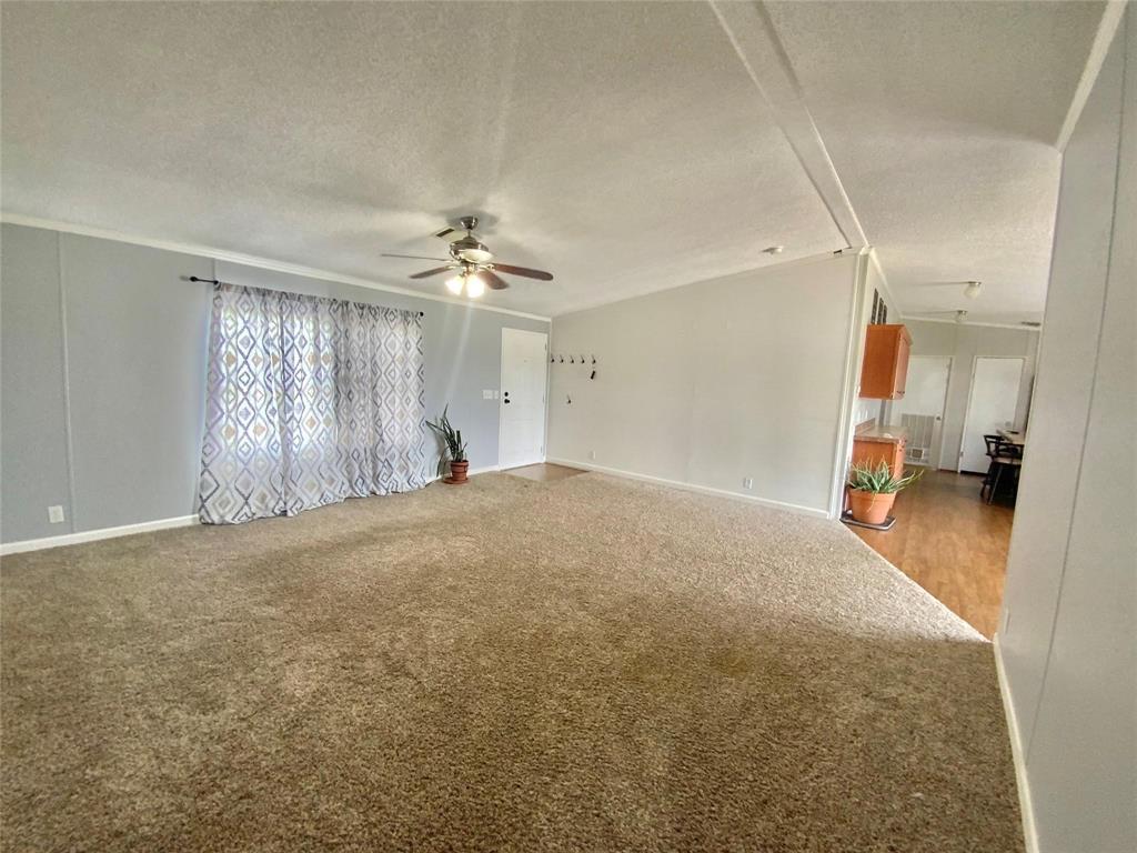 11255 Sam Reynolds Road Justin, TX 76247 - Photo 3 of 19 a view of a livingroom with a chandelier