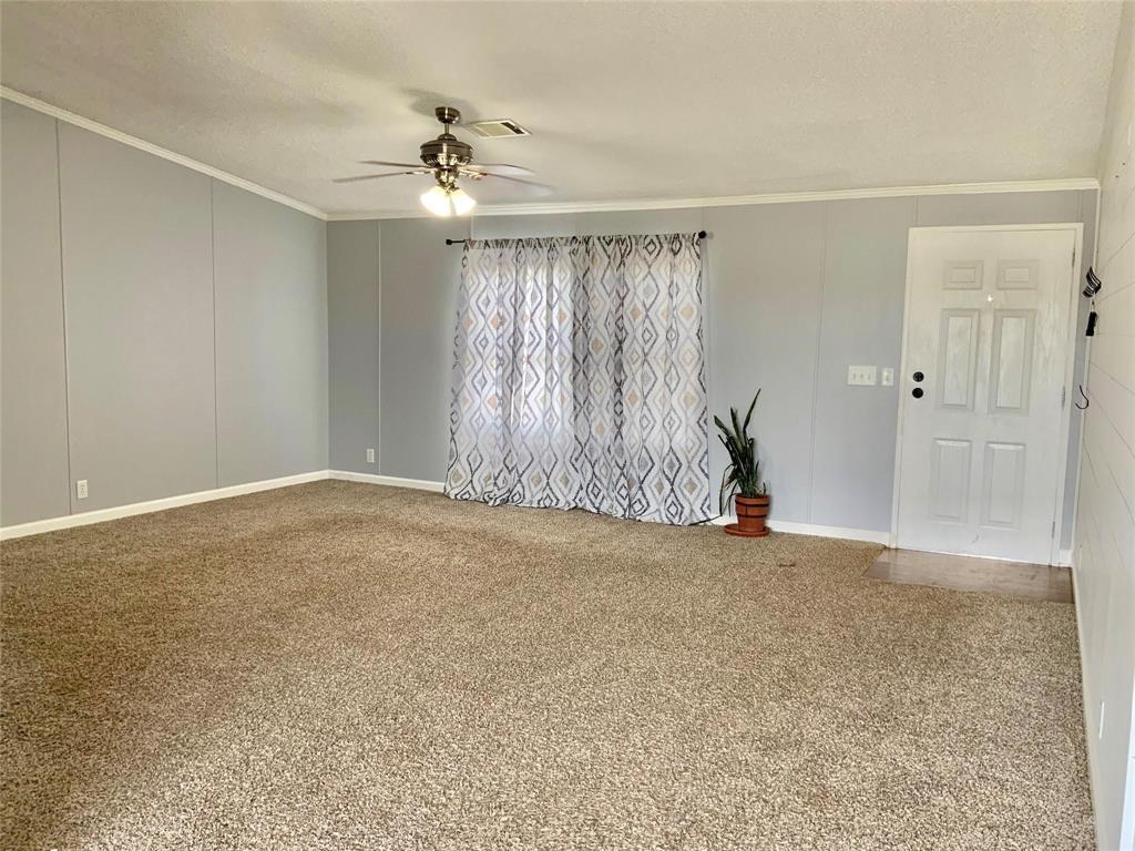 11255 Sam Reynolds Road Justin, TX 76247 - Photo 4 of 19 a view of an empty room with a window