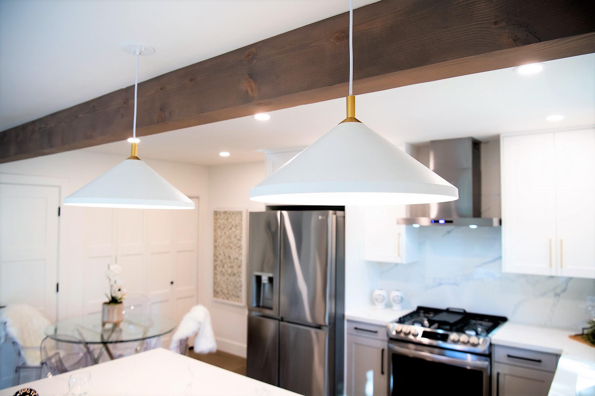 373 Northgate Drive, Unit A Goleta, CA 93117 - Photo 12 of 37 a kitchen with stainless steel appliances a refrigerator a sink a stove and white cabinets