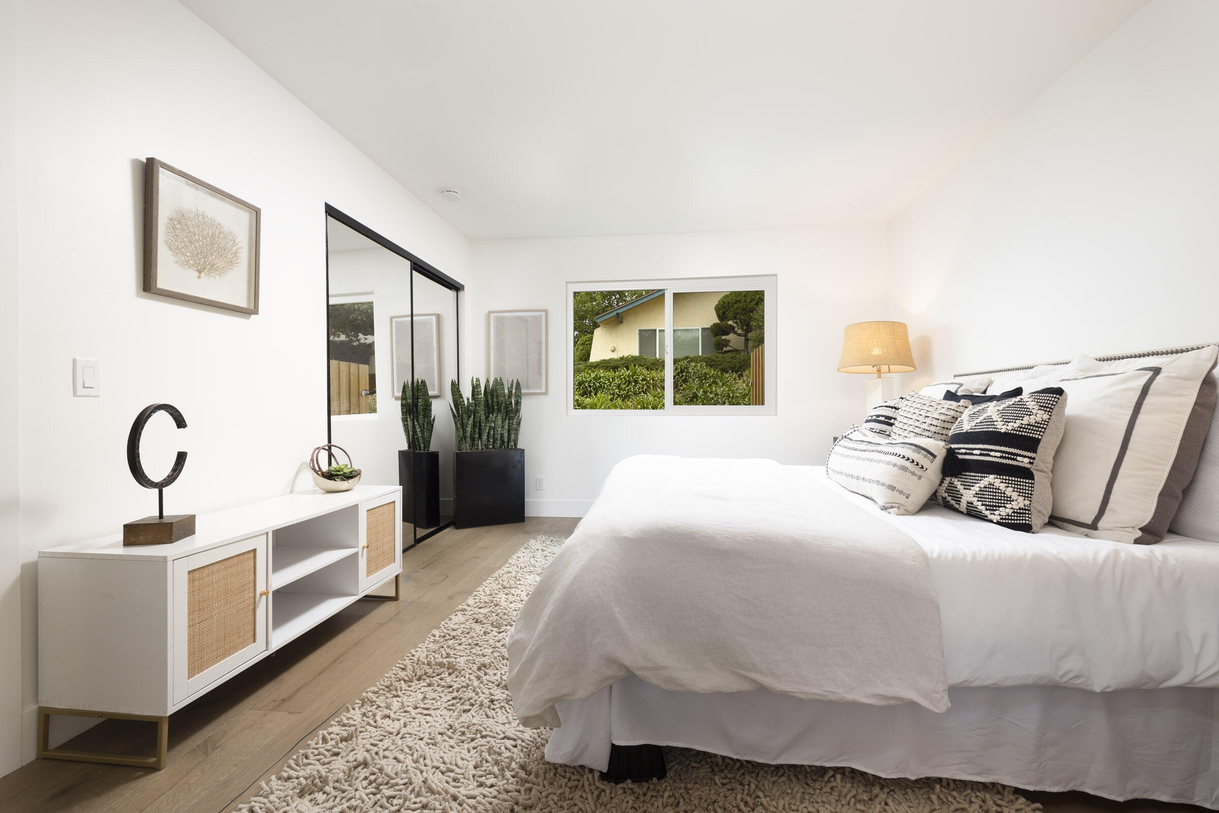 373 Northgate Drive, Unit A Goleta, CA 93117 - Photo 18 of 37 a bedroom with a bed and wooden floor