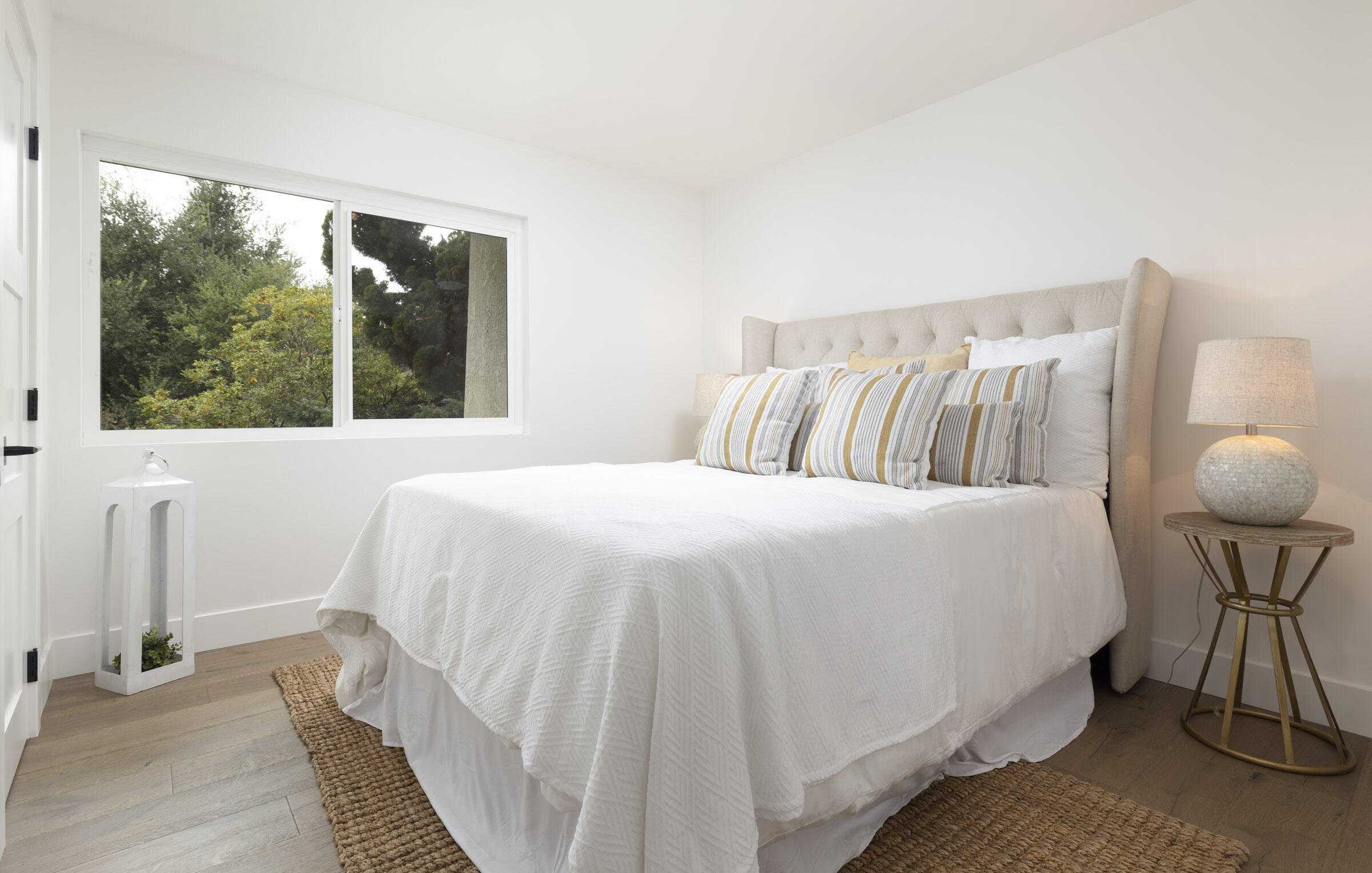 373 Northgate Drive, Unit A Goleta, CA 93117 - Photo 26 of 37 a bedroom with a bed and large windows