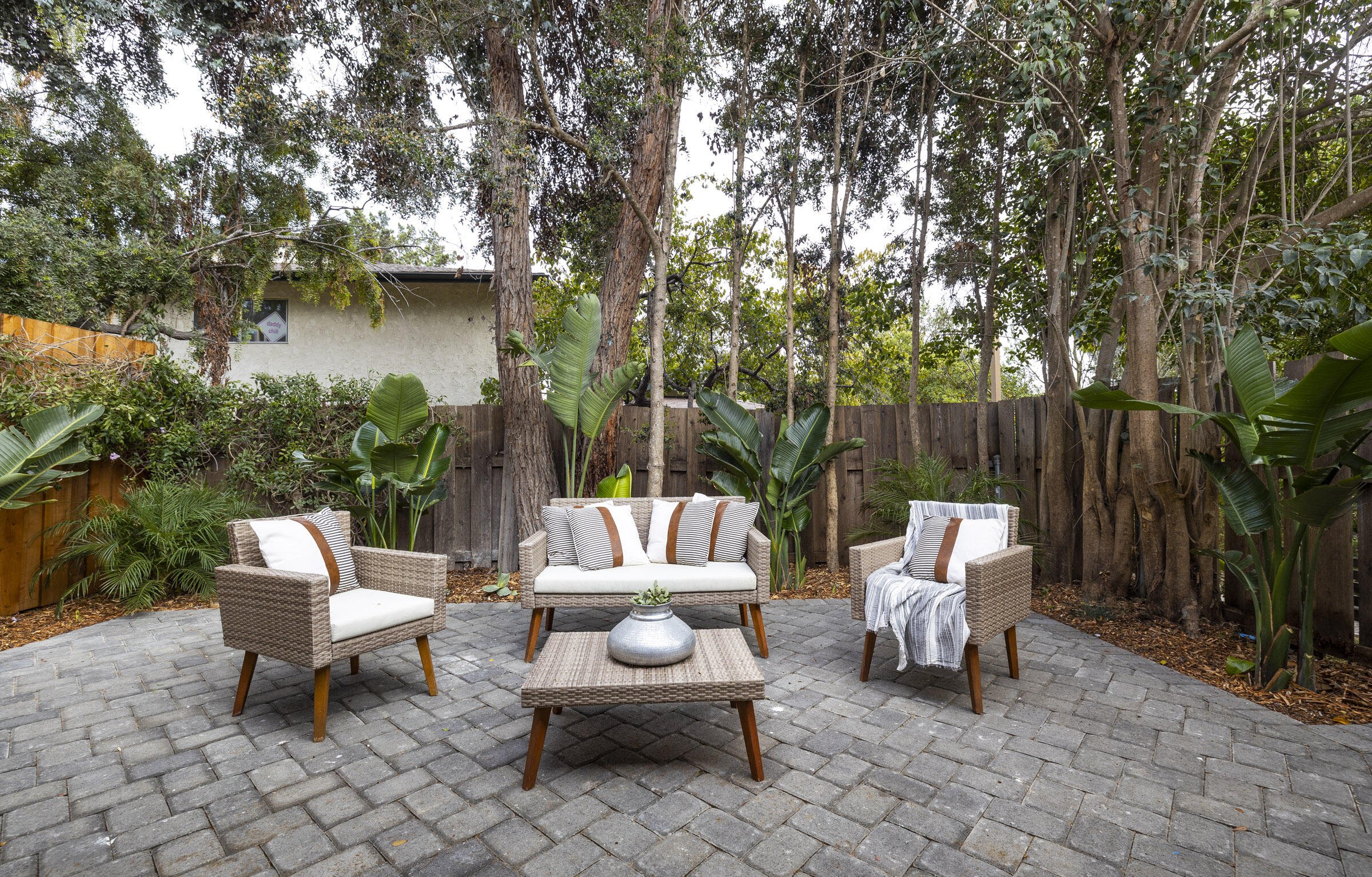 373 Northgate Drive, Unit A Goleta, CA 93117 - Photo 28 of 37 a backyard of a house with fountain table and chairs