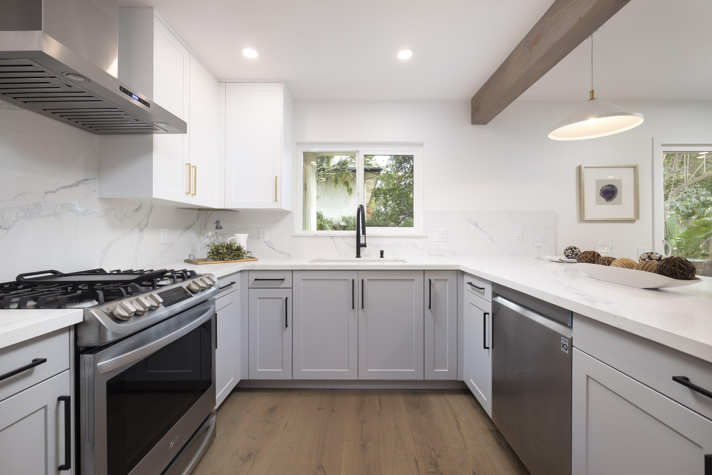 373 Northgate Drive, Unit A Goleta, CA 93117 - Photo 9 of 37 a kitchen with a sink stove and cabinets