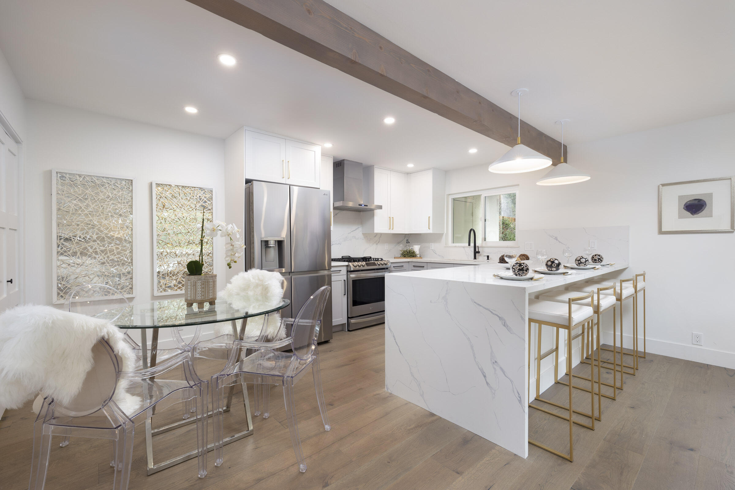 373 Northgate Drive, Unit A Goleta, CA 93117 - Photo 10 of 37 a kitchen with a dining table chairs refrigerator and cabinets