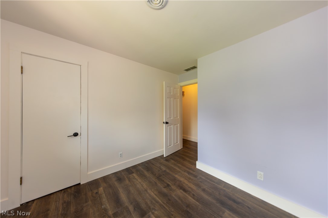 7969 Dines Road Novelty, OH 44072 - Photo 25 of 48 Spacious bedroom featuring wood-finish flooring, white baseboards, and a neutral wall color