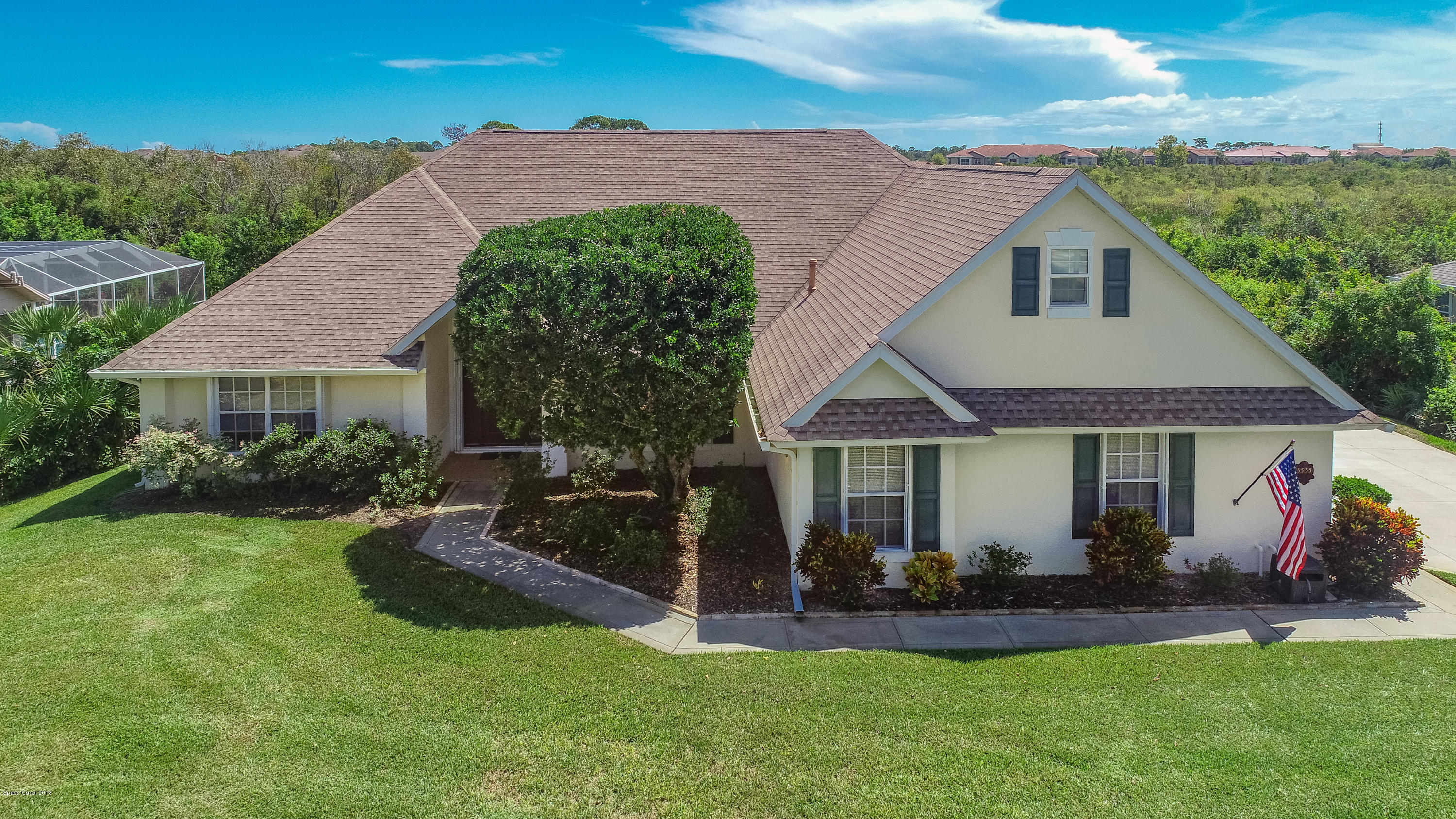 3535 Shady Run Road Melbourne, FL 32934 - Photo 1 of 30 a front view of a house with a yard porch and outdoor seating