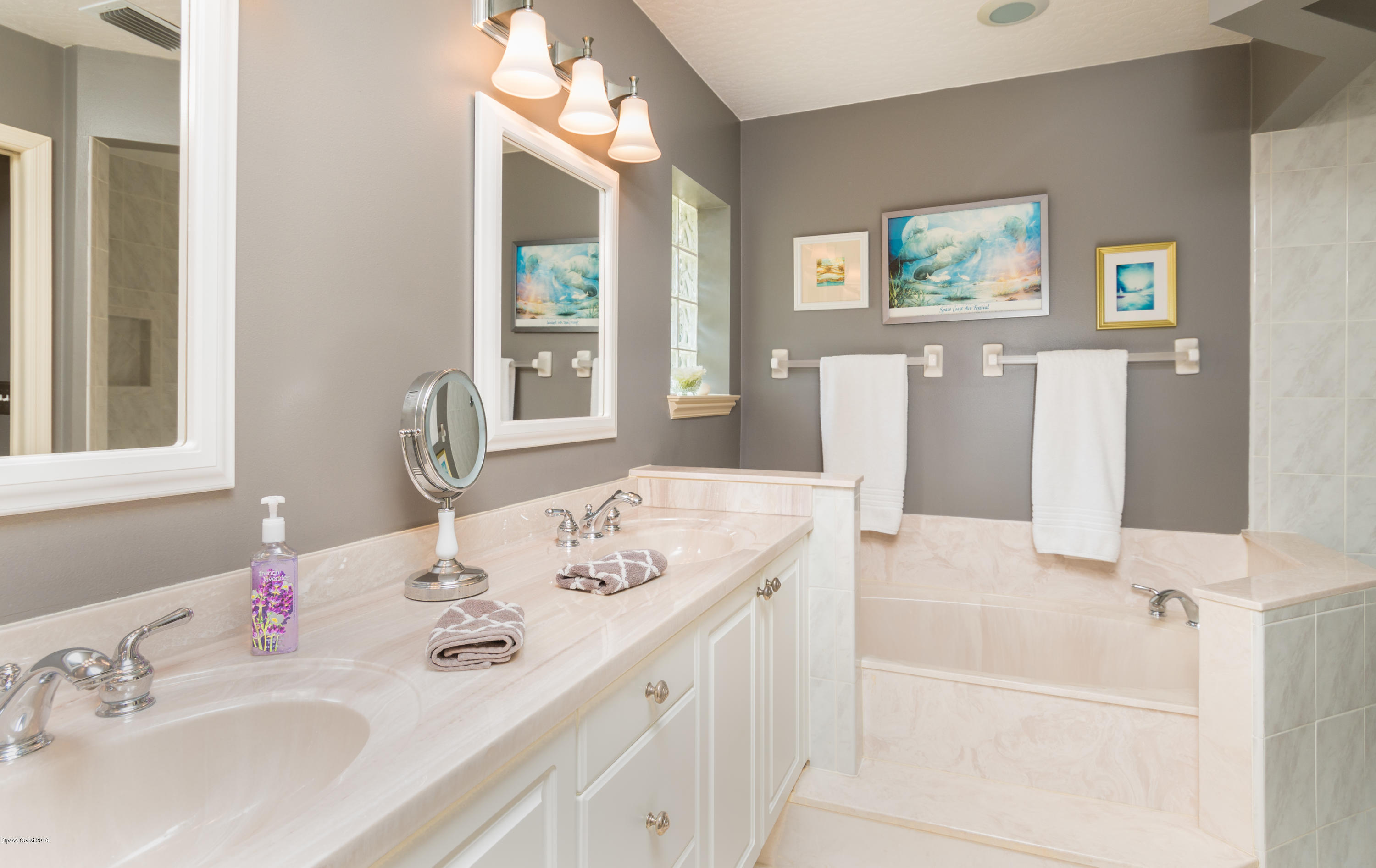 3535 Shady Run Road Melbourne, FL 32934 - Photo 14 of 30 a bathroom with a granite countertop sink and a mirror