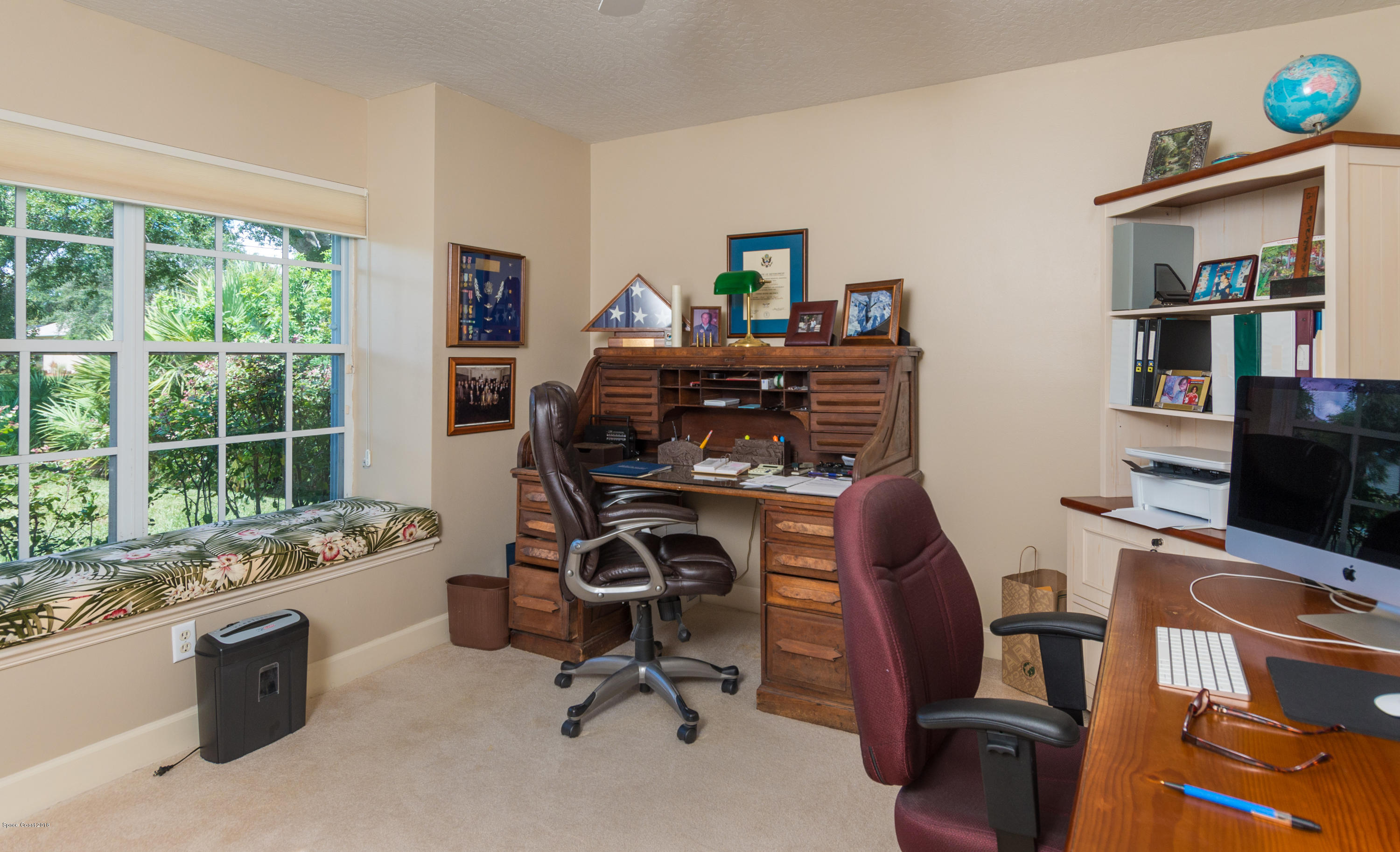 3535 Shady Run Road Melbourne, FL 32934 - Photo 15 of 30 a view of a workspace with furniture and a window