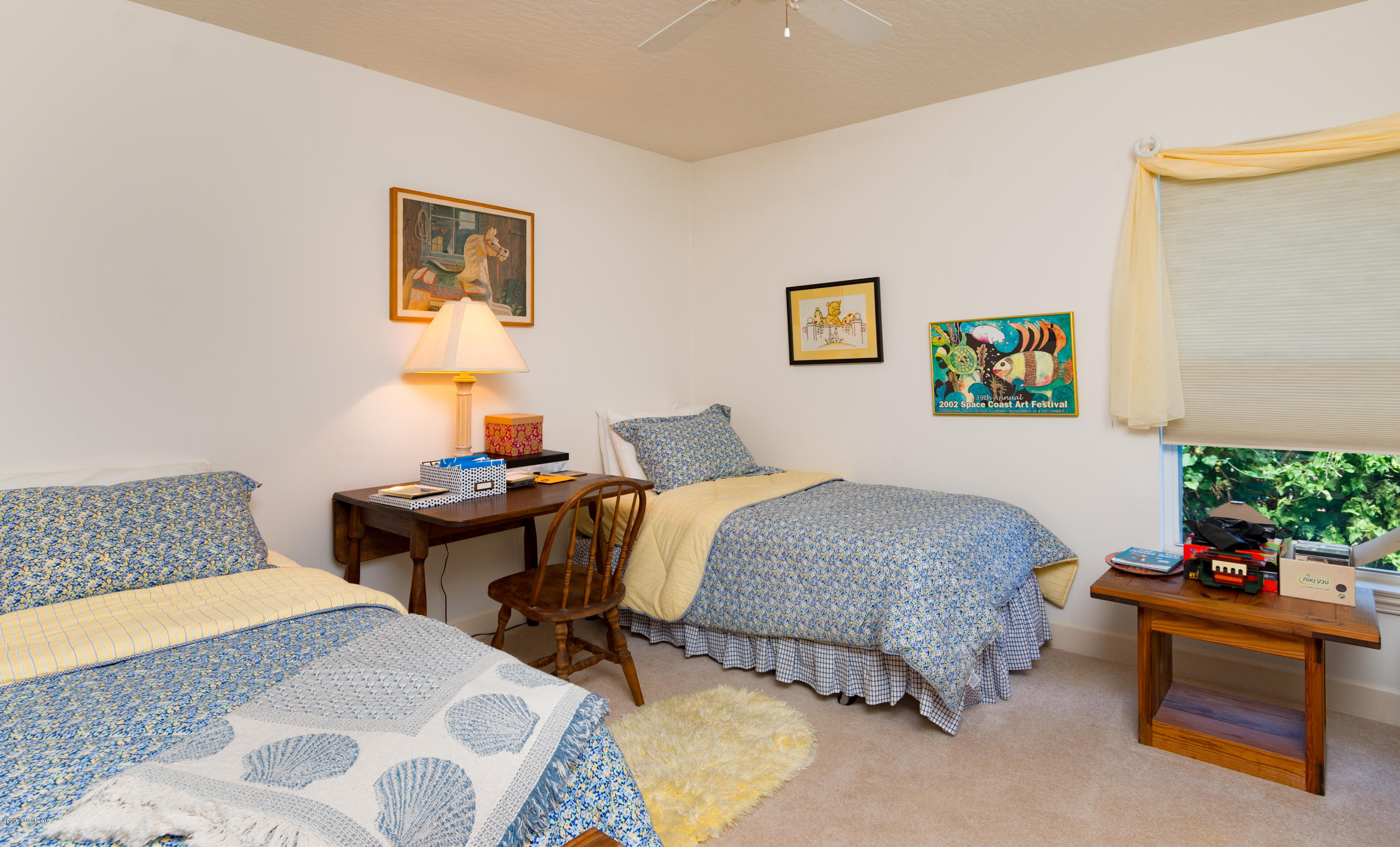 3535 Shady Run Road Melbourne, FL 32934 - Photo 16 of 30 a bedroom with bed and a couch