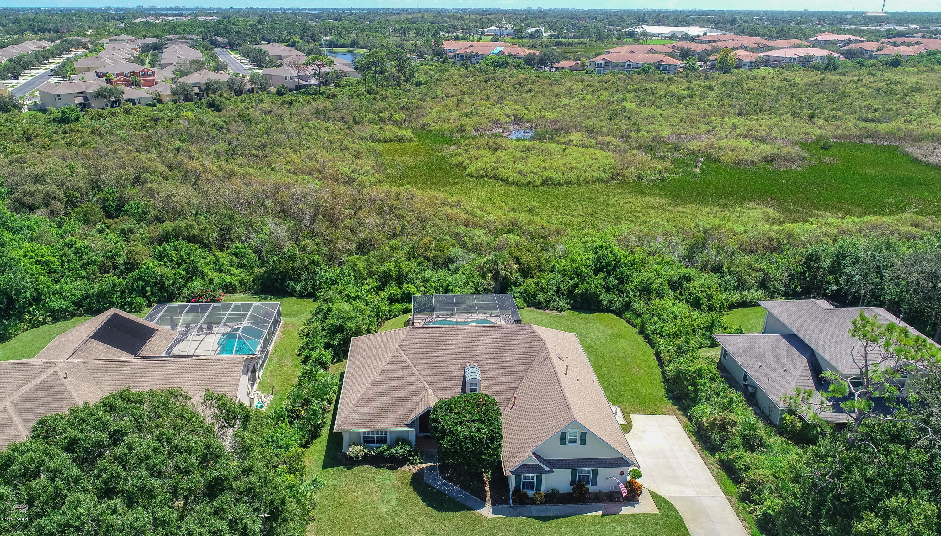 3535 Shady Run Road Melbourne, FL 32934 - Photo 23 of 30 an aerial view of multiple houses with yard