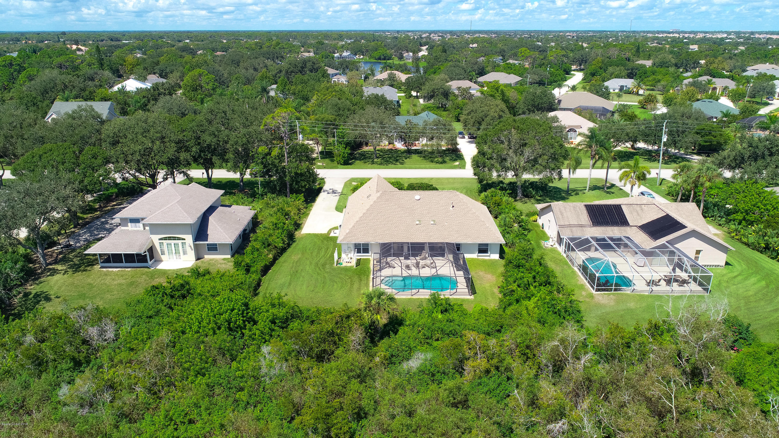 3535 Shady Run Road Melbourne, FL 32934 - Photo 25 of 30 an aerial view of a house with a yard and lake view