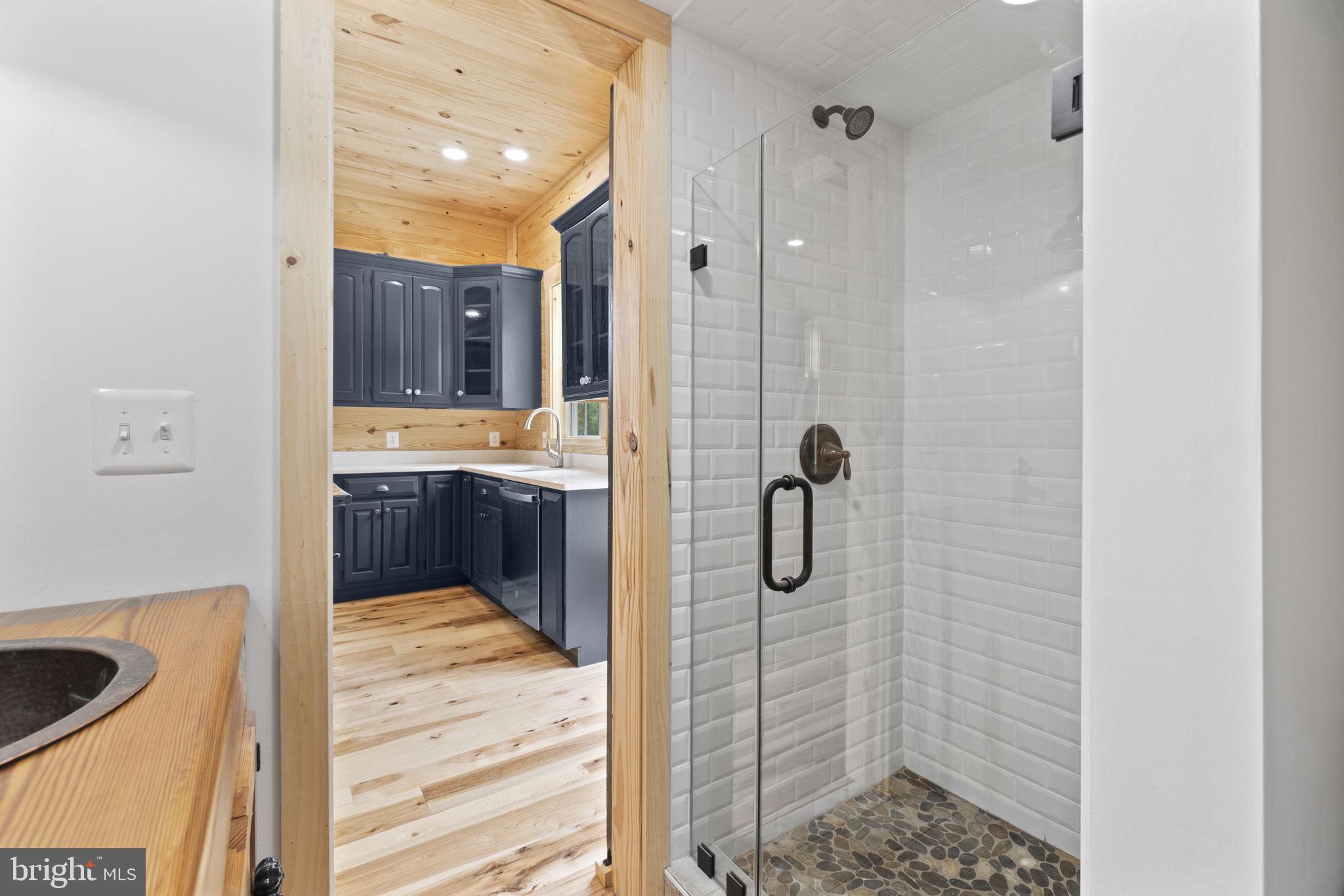 13316 Compton Road Clifton, VA 20124 - Photo 13 of 39 a bathroom with a shower and a sink