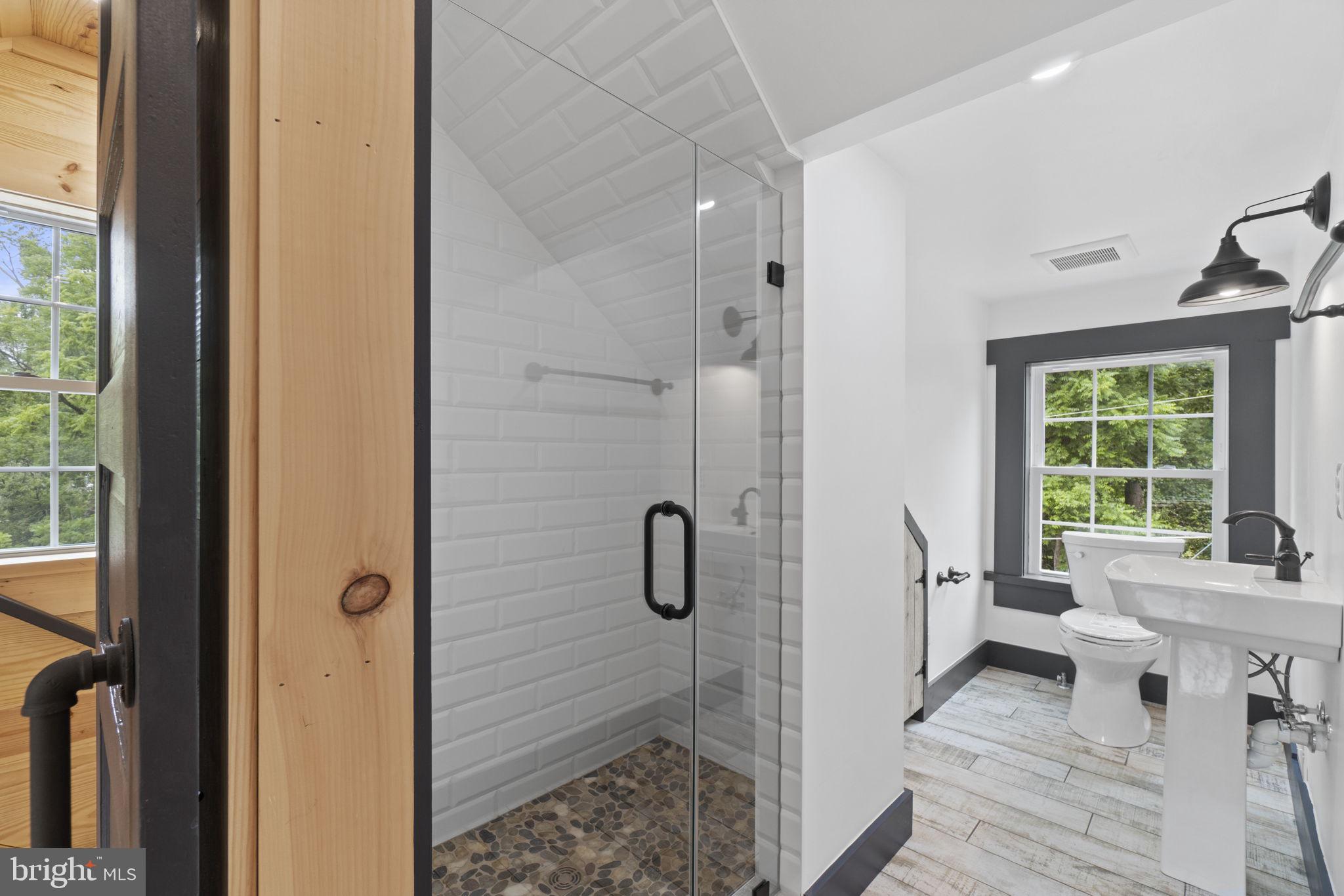 13316 Compton Road Clifton, VA 20124 - Photo 19 of 39 a bathroom with a tub shower and a window
