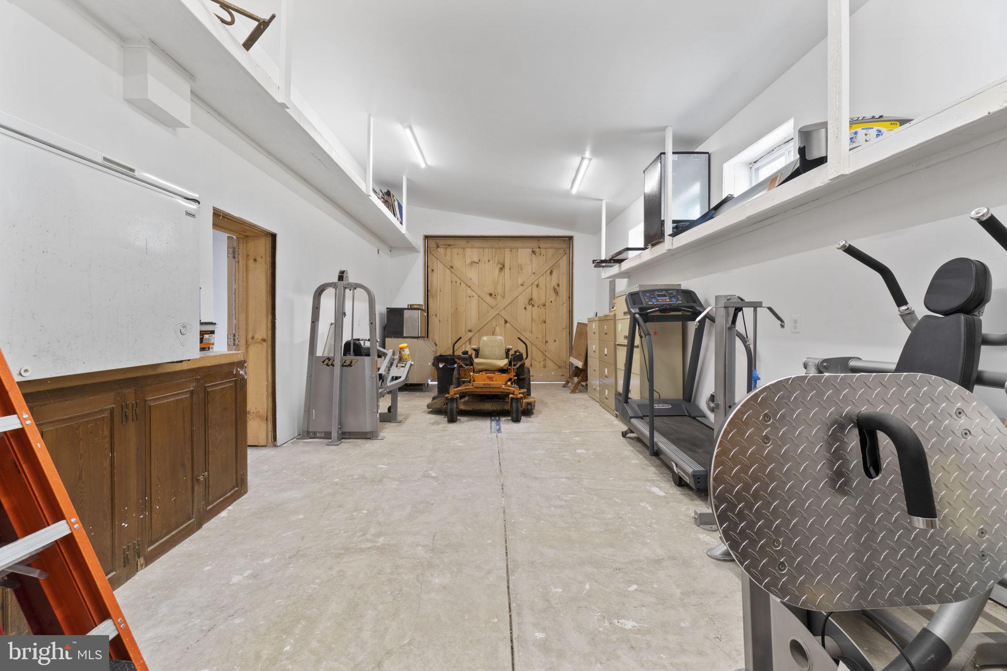 13316 Compton Road Clifton, VA 20124 - Photo 22 of 39 a view of gym equipment and livingroom view
