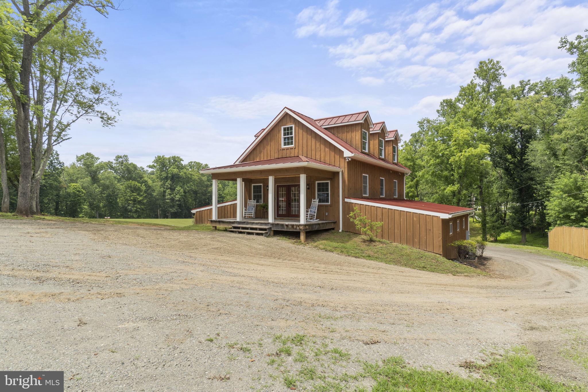 13316 Compton Road Clifton, VA 20124 - Photo 4 of 39 a front view of a house with a garden