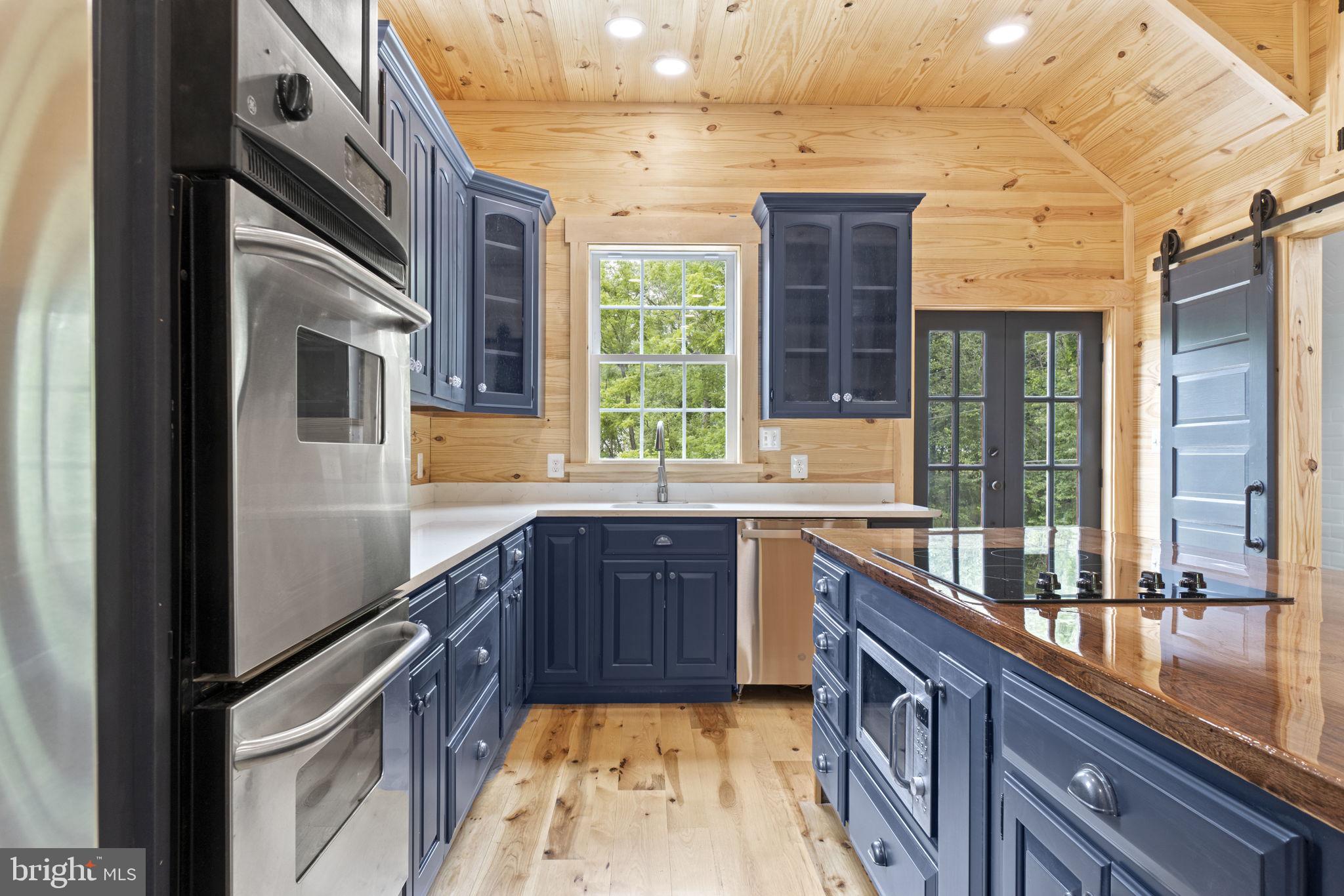 13316 Compton Road Clifton, VA 20124 - Photo 9 of 39 a kitchen with stainless steel appliances granite countertop a sink a stove and a refrigerator