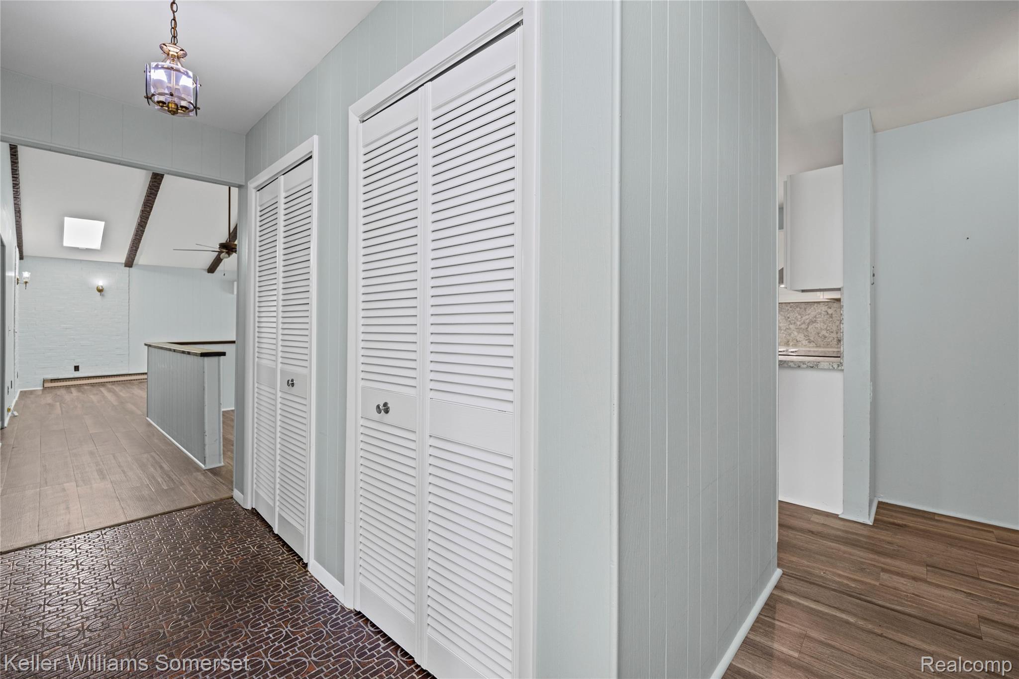 2344 Rochester Road Leonard, MI 48367 - Photo 8 of 66 Entryway featuring dual louvered closet doors and a decorative flush-mount ceiling light