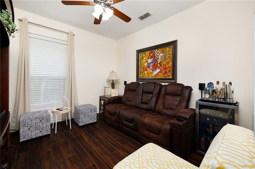 3901 Santa Veronica Street Mission, TX 78572 - Photo 13 of 22 a living room with furniture and a flat screen tv