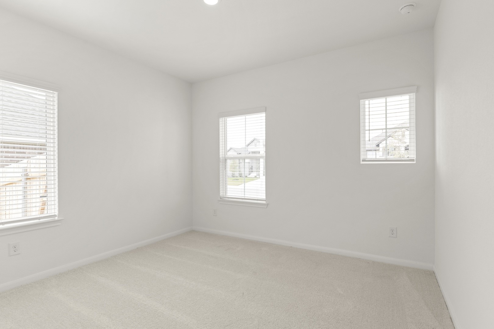 3725 Pin Oak Hills Seguin, TX 78155 - Photo 16 of 21 Empty room with light carpet and recessed lighting