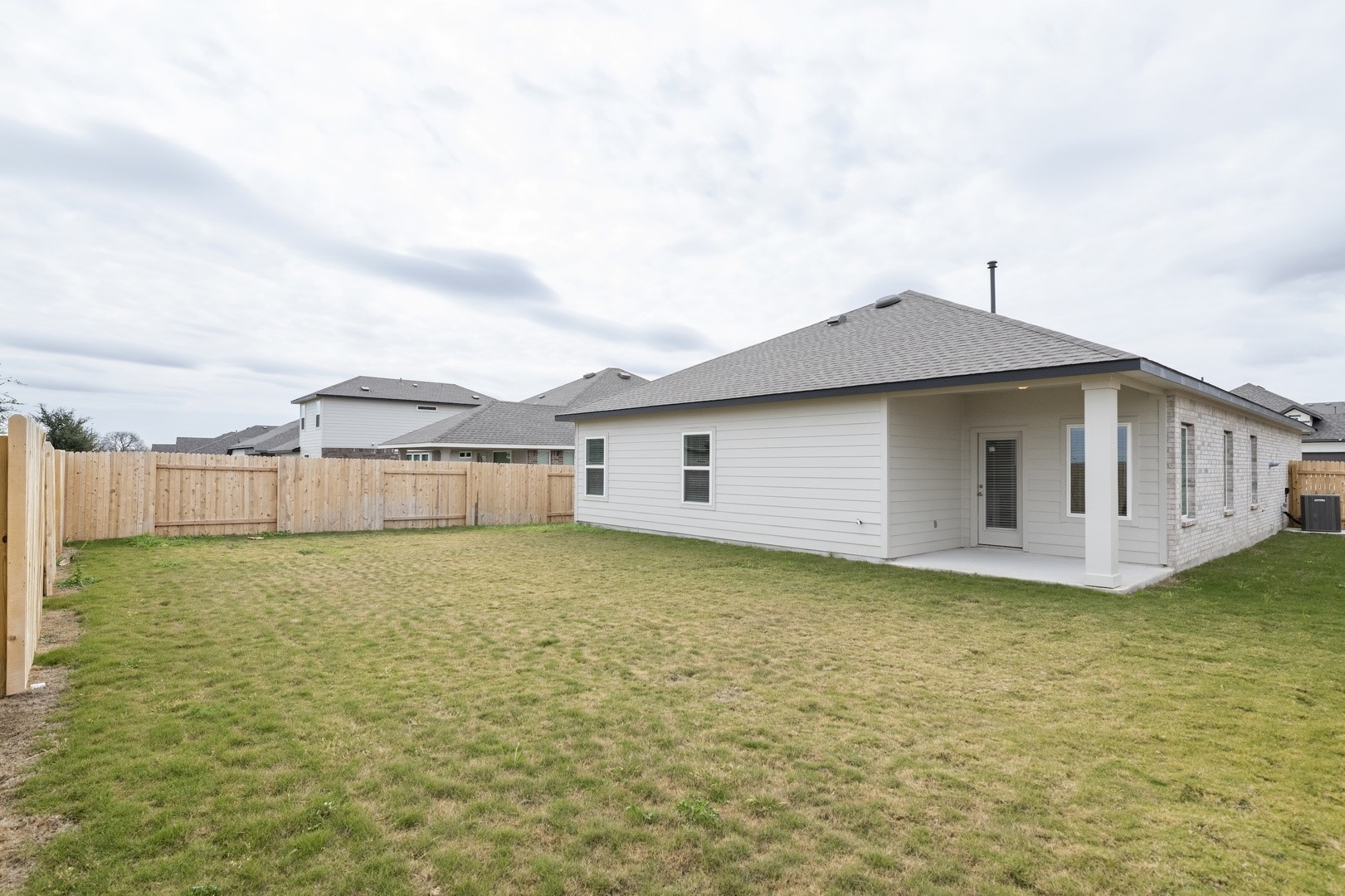 3725 Pin Oak Hills Seguin, TX 78155 - Photo 18 of 21 Back of house with a fenced backyard, a patio area, and a shingled roof