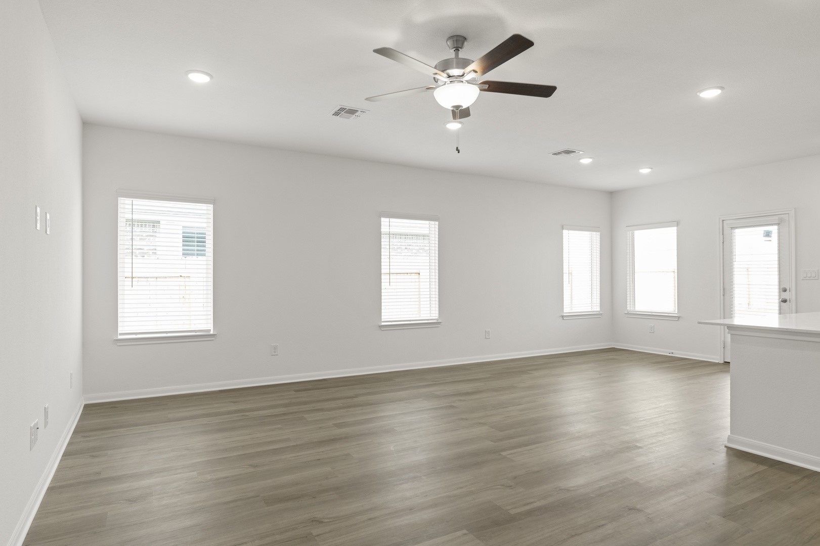 3725 Pin Oak Hills Seguin, TX 78155 - Photo 5 of 21 Unfurnished room with dark wood finished floors, recessed lighting, and ceiling fan