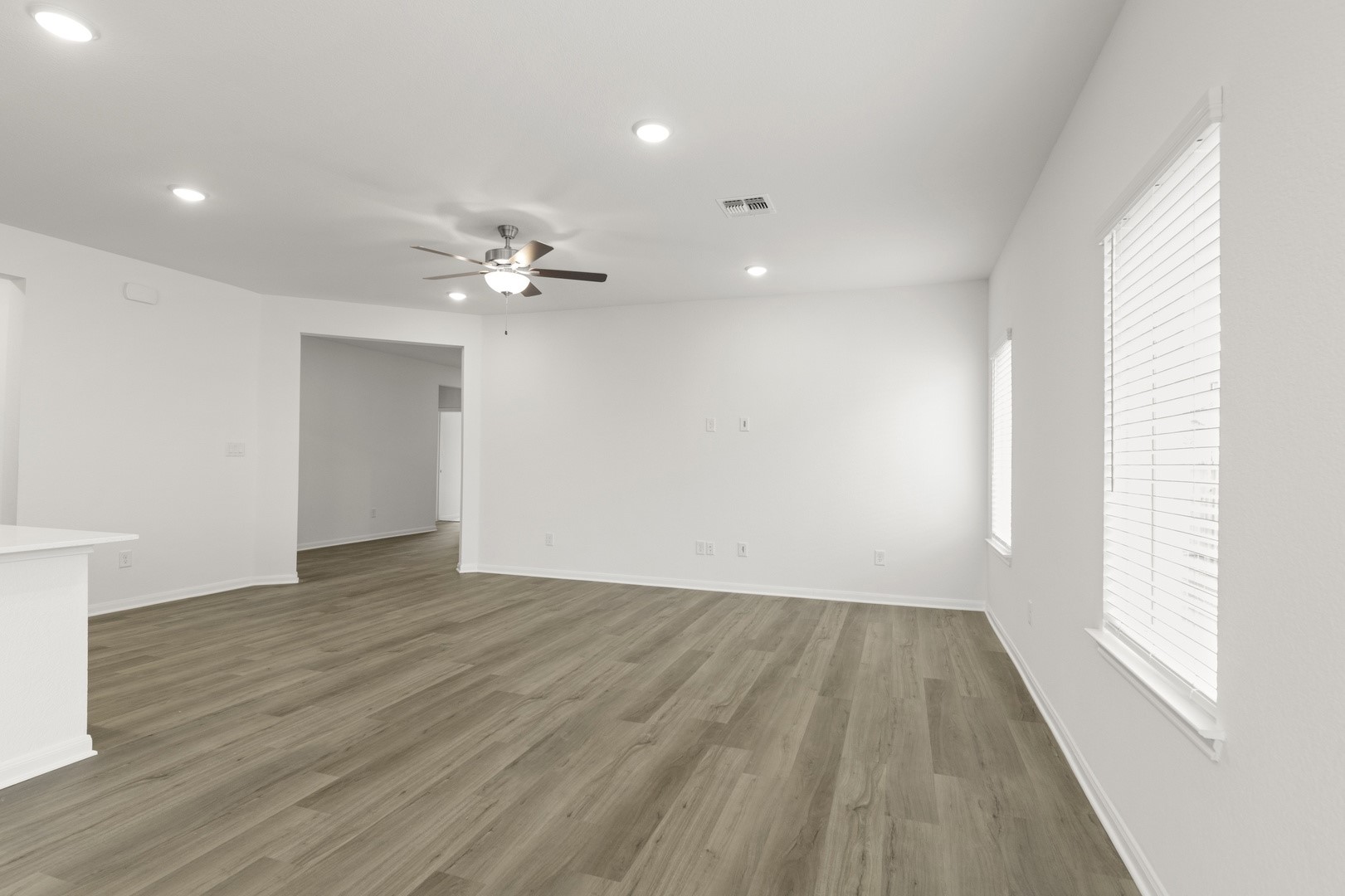 3725 Pin Oak Hills Seguin, TX 78155 - Photo 6 of 21 Spare room featuring wood finished floors, recessed lighting, and ceiling fan