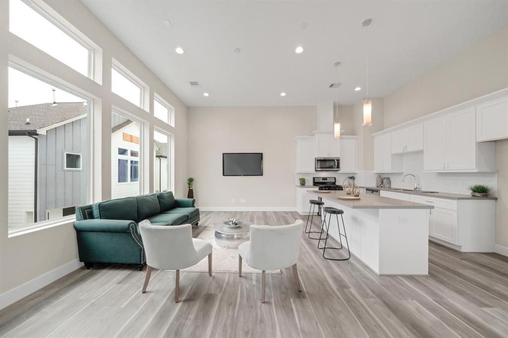 5904 Gardendale Drive, Unit D Houston, TX 77092 - Photo 2 of 7 a living room with furniture and a wooden floor