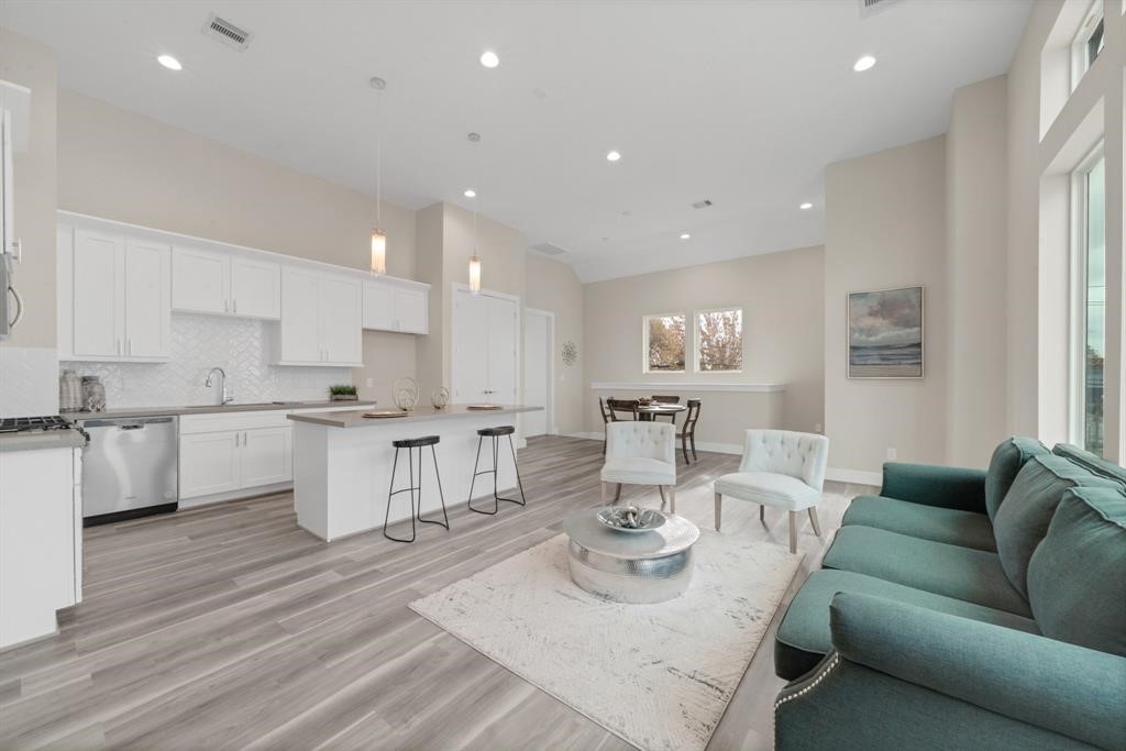 5904 Gardendale Drive, Unit D Houston, TX 77092 - Photo 3 of 7 a living room with kitchen island furniture and a kitchen view
