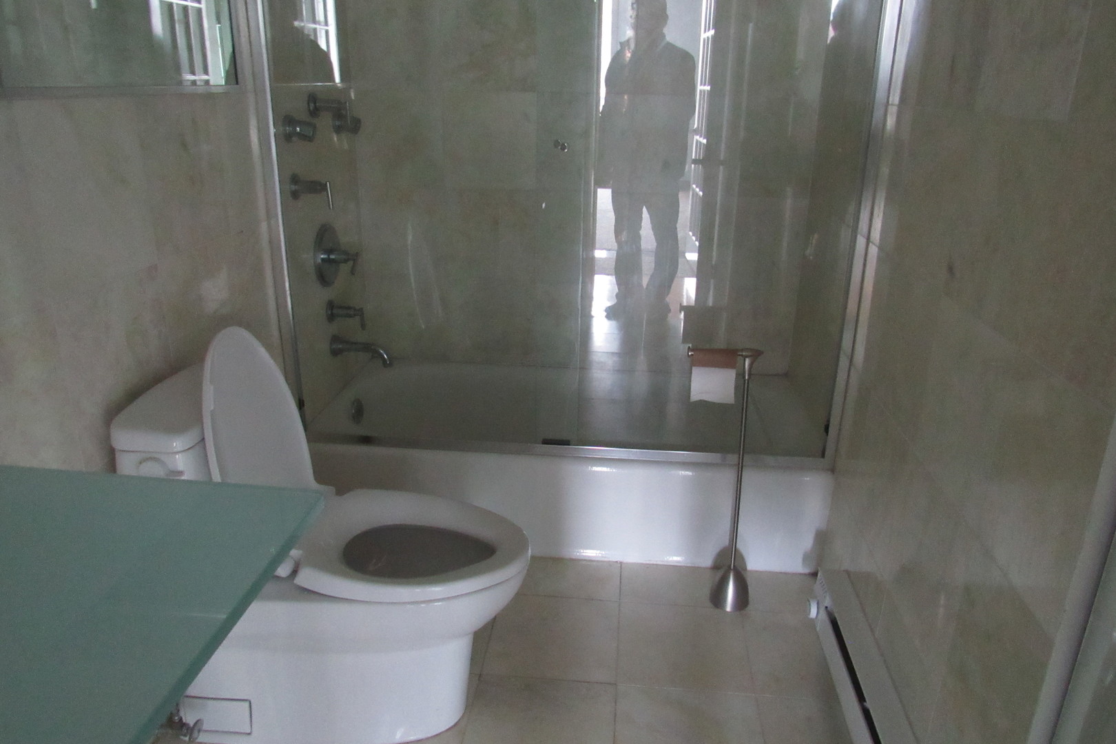 5855 North Sheridan Road, Unit 14CE Chicago, IL 60660 - Photo 10 of 14 a bathroom with a toilet and a shower
