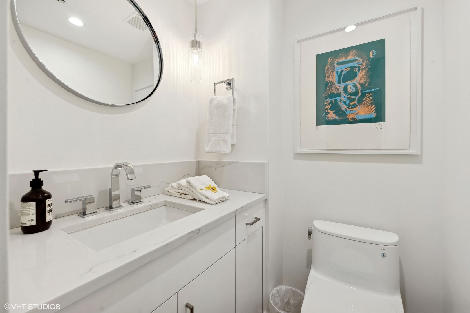 950 North Michigan Avenue, Unit 3404 Chicago, IL 60611 - Photo 16 of 26 a bathroom with a sink mirror and toilet